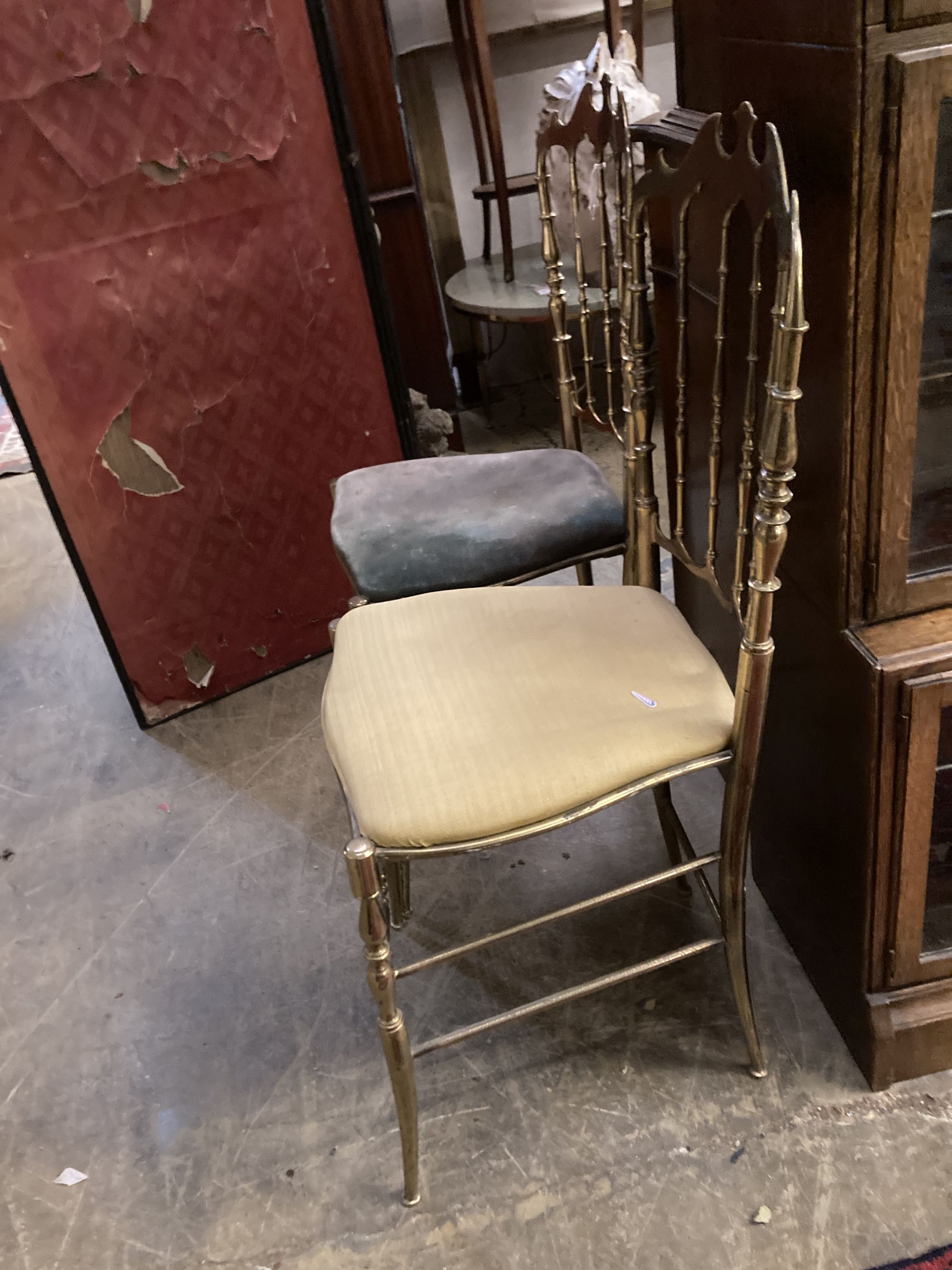 A pair of brass side chairs